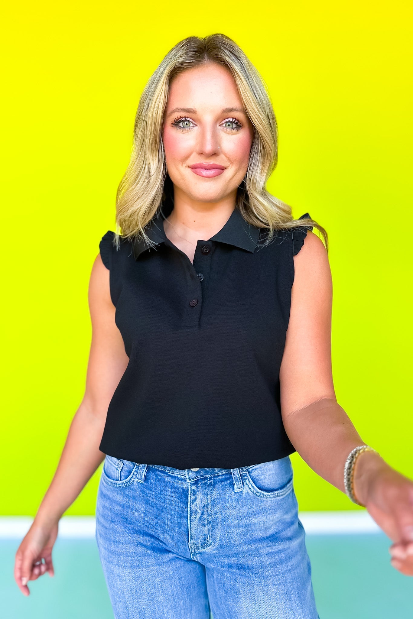 SSYS Mabel Sleeveless Ruffle Shoulder Polo Top In Black