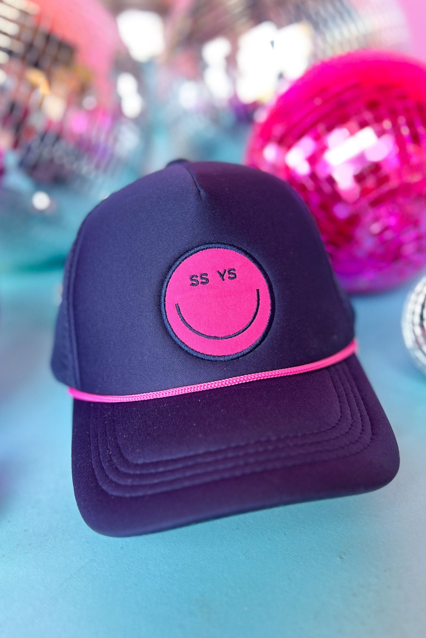 SSYS Navy And Pink Smiley Trucker Hat, accessory, hat, trucker, hat, smiley face hat, navy and pink accessory, navy and pink hat, navy and pink trucker hat, navy and pink smiley face hat, must have accessory, must have hat, elevated accessory, elevated hat, elevated style, elevated styling, Shop Style Your Senses by Mallory Fitzsimmons, SSYS by Mallory Fitzsimmons