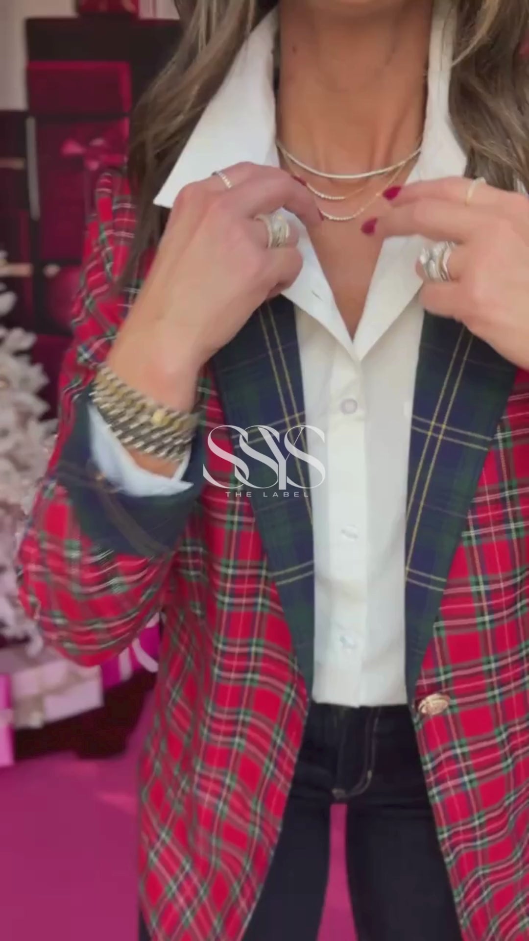 Make a bold holiday statement with our Noella Blazer in classic red tartan plaid. Featuring contrast navy lapels, gold button detail, and tailored structure, this festive blazer elevates any look — from casual denim to dressed-up layers. A timeless wardrobe staple perfect for winter gatherings, holiday parties, and beyond.