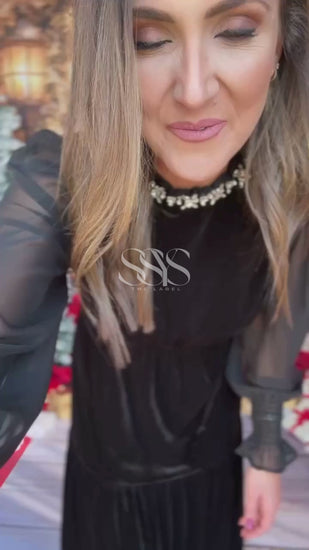 Elevate your winter wardrobe with the SSYS Velvet Sheer Sleeve Maxi Dress—where elegance meets drama. Crafted in rich velvet with semi-sheer sleeves and a high neckline adorned with subtle sparkle, this maxi dress is made for winter weddings, holiday parties, and seasonal soirées. The flattering tiered silhouette brings soft movement and timeless glamour to every step. A must-have for women’s winter fashion 2025.